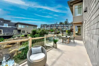 Generous Sun-drenched oversized deck perfect for gatherings, gardening, or relaxing.