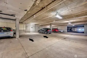 Two side by side parking spaces in gated garage convey with purchase.