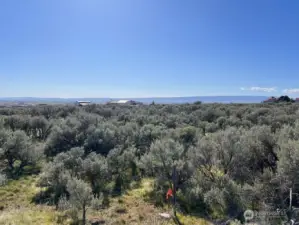 One of the four corners clearly marked. View looking South.