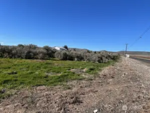 View looking North from South East corner of property and up Adams Road NW.
