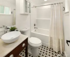Attached bathroom to the primary is modern and fresh!