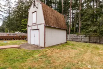 Back yard is mostly fenced with nice big pine trees on the acreage behind.  Also allows for some privacy