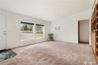 Spacious vaulted Living room with built in bookcases and cabinets
