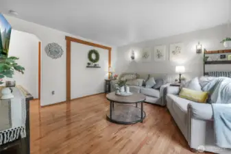 Living Room – Bright, inviting gathering space with farmhouse details and hardwood floors.