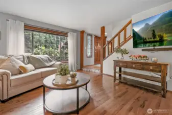 Living Room – Large picture window brings in natural light and frames front yard views.