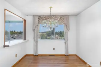 The dining room is perfectly positioned between the living room and kitchen, making mealtime and entertaining effortless!