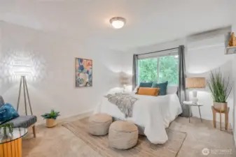 The spacious primary bedroom features a 3/4 bath and walk-in closet offering comfort, convenience, and ample storage.