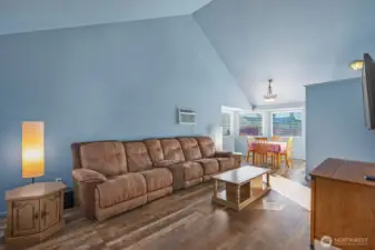 Enter into a double height living room with vaulted ceilings, bringing in plenty of natural light.