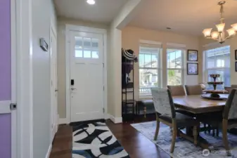 Entry way. Coat closet and plenty of room. Formal dining area with lots of natural light. Sixth bedroom/Office located to the left off the hallway.