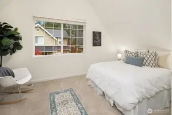 Another bedroom with vaulted ceilings.