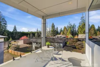 Spacious covered balcony off of primary bedroom