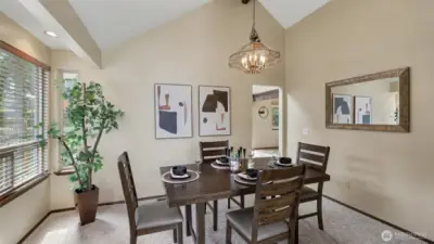 Formal dining area seamlessly connects the kitchen and main living area.