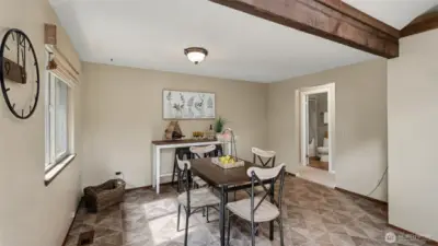 Area off of the kitchen  could also make an additional living space.