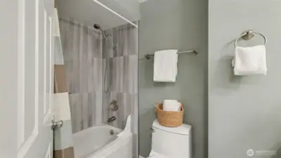 Tile shower and quartz counters.