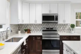 The tilework in the second kitchen has such a timeless and classy look with the seamless countertops