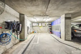 The car wash area is located on the same level as the deeded parking spaces.