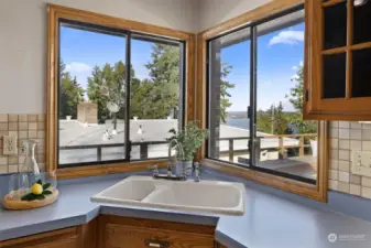 Kitchen window looks at water views and seaplanes coming into port