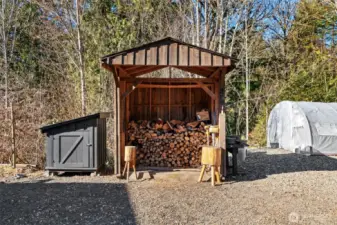 Woodshed. Small shed is for a full house generator.