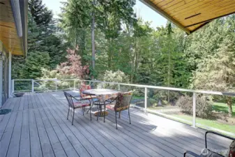 Relax over your morning coffee seated on the deck overlooking the tranquil terraced garden. Take in the sun in complete privacy screened from neighbors by trees that frame the yard. Dine al fresco and sip cocktails every evening with sunsets. Make the most of outdoor living and entertainment.