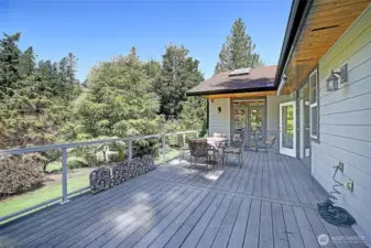 Deck is steps outside the Primary Suite, Great room and dining room.