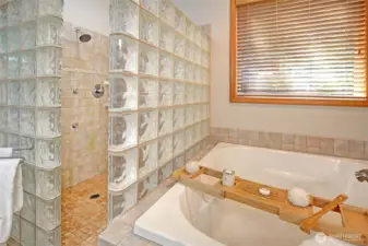 Deep soaking tub and oversized glass block enclosed shower. Enjoy the luxury of stepping out onto a comfortably heated floor.