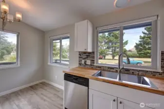 Completely updated kitchen with new flooring, cabinets, fixtures, appliances and lighting.