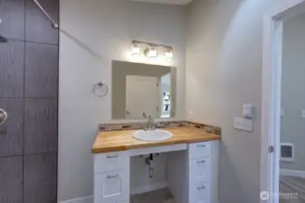 Handicap accessible bathroom with roll in shower.