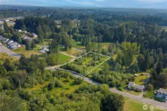 Aerial view of this large 1.685 flat acres ready to buy and use for all your needs.  All utilities are in the street in front of property
