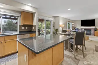 Silestone countertops create the perfect space for gatherings while cooking, seamlessly flowing into the family room.