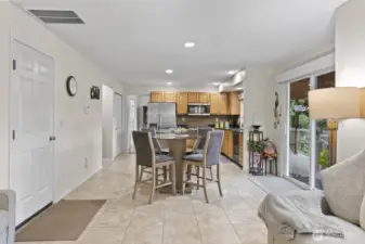 The kitchen includes a cozy eating area, perfect for casual meals, homework, or gatherings with friends and family for conversations and fun.