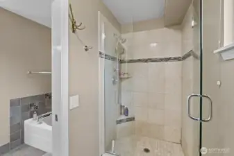 The shower showcases expert tile work, creating a stylish and refined focal point in the bathroom.