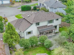 The home features a newer roof equipped with leaf guards, combining durability with low-maintenance convenience.