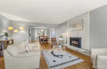 Living room on main level with dining room behind it