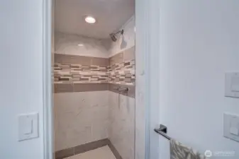 Shower in primary bath has just been remodeled.