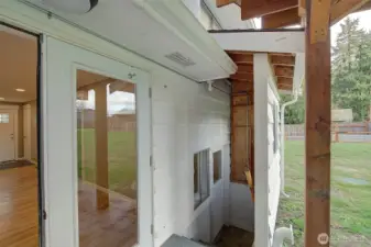 Stairs off of patio leads to utility room on lower level.