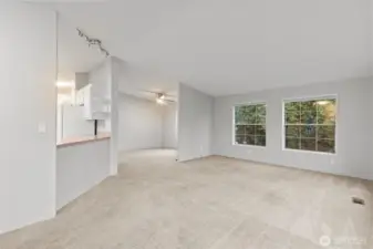 The layout of the front of the home is perfect with vaulted ceilings and oversized windows offering a lot of natural southern exposure.  The entire home has been freshly painted in an updated color and ceilings were all painted white.  Fresh paint has given this space a new look and very updated feel!  The Dining Room has its own dedicated space, separate from the Living Room.  Either way, it feels like a Great Room when you are there and the open concept of this part of the home was deisgned to keep people together.