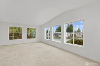 Oh my windows!  The front windows have SW exposure, and the lovely mature landscaping allows for a bit of privacy from neighbors as well as really giving the home a park-like feel.  Plenty of outlets and comfortable forced air heat.  You can spy on everyone from here!