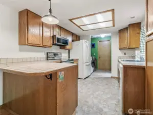 KITCHEN WITH LAUNDRY AT BACK