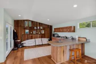 The beach cabin interior entry and kitchen area.