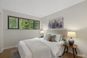 Second bedroom with equally peaceful wooded views.