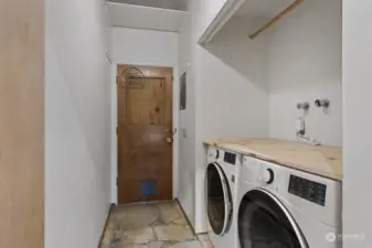 Handy laundry room with extra storage space.