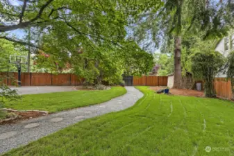 The spacious front yard has ample space for pets, gardens and play.