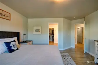 Primary bedroom looking towards bathroom and hallway on right.