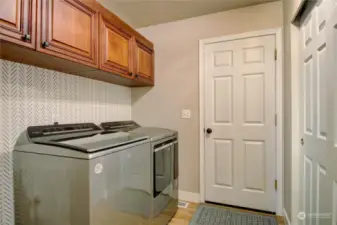 Laundry room with extra storage.