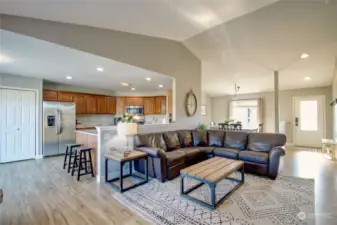 Great room looking to kitchen area and formal dining room.