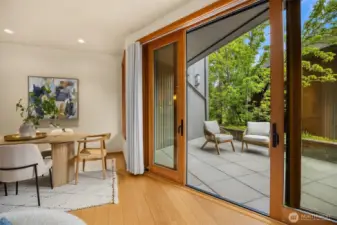 The inviting patio offers a sunny place to enjoy the greenery, as well as a sheltered area for those days of misty rain.