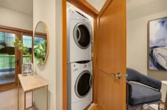The laundry closet off the flex space holds full-size stacking washer and dryer, both of which convey to the next owners.