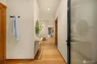 From the welcoming front vestibule, the rest of the home remains quite private. To the immediate left of the entry door, you’ll find the power room for guests. The door to the right leads to the beautiful en-suite bedroom. to the left beyond the bedroom is the flex space (used by past residents as a den, media room, overnight guest space, or office). the kitchen and great room are farthest from the door, adjacent to the private patio.