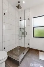 Luxury Shower with Stone Floor, Rain Head, Handheld and Full Glass Enclosure