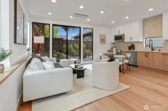 "Wall of Windows" with Oversized Sliders to Private Yard